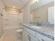 Bathroom featuring a tub-shower, and a vanity with granite countertop at 11533 Valley Oak Ln, Stanfield, NC 28163