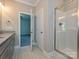 Well-lit bathroom showcasing a glass shower and doorway leading to a bedroom at 11533 Valley Oak Ln, Stanfield, NC 28163