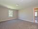 Empty bedroom with carpet and natural light from the window at 11533 Valley Oak Ln, Stanfield, NC 28163