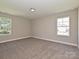 A vacant bedroom featuring neutral walls, carpeted floors and natural light at 11533 Valley Oak Ln, Stanfield, NC 28163