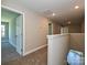 Spacious hallway with carpet and a view of stairs leading to the lower level at 11533 Valley Oak Ln, Stanfield, NC 28163