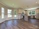 Modern kitchen with stainless steel appliances and an island, with lots of windows at 11533 Valley Oak Ln, Stanfield, NC 28163