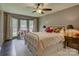 Comfortable bedroom with bay window, ceiling fan, and neutral decor at 116 Hallett St, Fort Mill, SC 29715