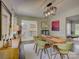 Dining area with modern light fixture, unique artwork, and seating for six at 116 Hallett St, Fort Mill, SC 29715