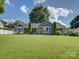 Charming home featuring a well-manicured lawn and a striking yellow front door at 116 Hallett St, Fort Mill, SC 29715