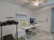 Bright office space with treadmill, desk, and ceiling fan at 116 Hallett St, Fort Mill, SC 29715