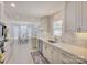 Bright kitchen with white cabinets, stainless appliances, and dining area with large window at 116 Hallett St, Fort Mill, SC 29715