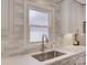 Updated kitchen with stainless steel sink, subway tile backsplash, and quartz countertops at 116 Hallett St, Fort Mill, SC 29715