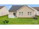 Well-maintained backyard with manicured lawn and neutral siding at 11608 Downy Birch Rd, Charlotte, NC 28227