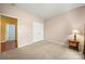 Bedroom featuring neutral walls, carpet flooring, and a classic bedside table with lamp at 11608 Downy Birch Rd, Charlotte, NC 28227