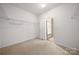 Bedroom view with walk-in closet featuring a door to the bathroom at 11608 Downy Birch Rd, Charlotte, NC 28227