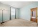 Bright bedroom featuring neutral carpet, a window with curtains and a view into another room at 11608 Downy Birch Rd, Charlotte, NC 28227
