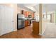 Cozy kitchen with wood cabinets, stainless steel appliances, and ample counter space at 11608 Downy Birch Rd, Charlotte, NC 28227