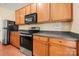 Well-equipped kitchen with stainless steel appliances, wood cabinets and laminate countertops at 11608 Downy Birch Rd, Charlotte, NC 28227