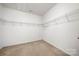 Spacious walk-in closet with metal shelving offers ample storage space at 11608 Downy Birch Rd, Charlotte, NC 28227