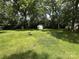 Large backyard with storage shed and mature trees at 118 Hemphill Ave, Chester, SC 29706