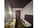Bathroom with a clawfoot tub, storage and sink at 118 Hemphill Ave, Chester, SC 29706