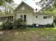 View of home's exterior showing siding and windows, with yard and landscaping at 118 Hemphill Ave, Chester, SC 29706