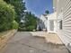 Spacious backyard with concrete patio and lush greenery providing a private outdoor space at 12131 Honor Guard Ave, Charlotte, NC 28277