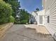 Spacious backyard with concrete patio and lush greenery providing a private outdoor space at 12131 Honor Guard Ave, Charlotte, NC 28277