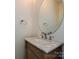 Bathroom vanity with marble countertop and decorative wood at 12131 Honor Guard Ave, Charlotte, NC 28277