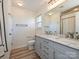 Bathroom featuring double sink vanity and a large mirror at 12131 Honor Guard Ave, Charlotte, NC 28277