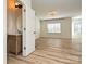 Spacious bedroom with natural light, hardwood floors, and modern lighting at 12131 Honor Guard Ave, Charlotte, NC 28277