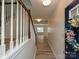 Welcoming entryway showcasing hardwood floors, a staircase with white railings, and a decorated front door at 12131 Honor Guard Ave, Charlotte, NC 28277