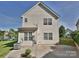 Well-maintained two-story home with vinyl siding, double-paned windows, and a landscaped yard at 12131 Honor Guard Ave, Charlotte, NC 28277