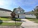 Inviting front yard with lush lawn, mature trees, and meticulously maintained landscaping at 12131 Honor Guard Ave, Charlotte, NC 28277