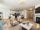Open-concept living area flowing into a modern kitchen with stainless steel appliances and ample counter space at 12131 Honor Guard Ave, Charlotte, NC 28277