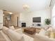 Bright living room with neutral walls, hardwood floors, fireplace, and comfortable seating arrangement at 12131 Honor Guard Ave, Charlotte, NC 28277