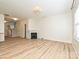 Spacious living area with wood flooring, a cozy fireplace, and a bright, airy feel at 12131 Honor Guard Ave, Charlotte, NC 28277