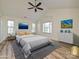 Staged main bedroom with vaulted ceilings and decorative artwork at 12131 Honor Guard Ave, Charlotte, NC 28277