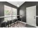 Cozy breakfast nook with bar seating, a view of the yard, and a modern pendant light at 124 Turning Leaf Ln, Statesville, NC 28677