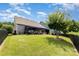Spacious backyard features a well-maintained lawn, fenced perimeter, and patio area ideal for outdoor activities at 126 W Morehouse Ave, Mooresville, NC 28117