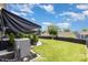 Large, well-maintained backyard featuring a lush lawn, privacy fence, and shade trees at 126 W Morehouse Ave, Mooresville, NC 28117