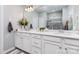 Bright bathroom boasts a double sink vanity and a glass enclosed shower at 126 W Morehouse Ave, Mooresville, NC 28117