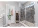 Stylish bathroom showcasing a walk-in shower with gray tile and decorative wooden ladder at 126 W Morehouse Ave, Mooresville, NC 28117