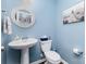 Well lit half bathroom with a stylish sink and toilet at 126 W Morehouse Ave, Mooresville, NC 28117