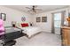 Bright bedroom features a ceiling fan, a functional desk and ample space at 126 W Morehouse Ave, Mooresville, NC 28117