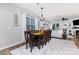Charming dining area featuring a wooden table with seating for six and modern chandelier at 126 W Morehouse Ave, Mooresville, NC 28117