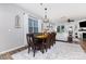 Inviting dining room with hardwood floors, a wooden table set, and plenty of natural light at 126 W Morehouse Ave, Mooresville, NC 28117