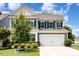 Charming two-story home featuring a well-maintained lawn, blue shutters, and an attached two-car garage at 126 W Morehouse Ave, Mooresville, NC 28117