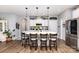 Modern kitchen with a large center island, stainless steel appliances, and ample storage space at 126 W Morehouse Ave, Mooresville, NC 28117