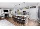 Bright open kitchen with a large island, white cabinets, and pendant lighting at 126 W Morehouse Ave, Mooresville, NC 28117