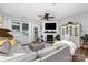 Cozy living room with a large sectional sofa, fireplace, and stylish decor at 126 W Morehouse Ave, Mooresville, NC 28117