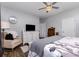Comfortable bedroom features a beautiful ceiling fan, a dresser and ample space at 126 W Morehouse Ave, Mooresville, NC 28117
