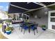 Relaxing covered patio features comfortable seating and a dining table for outdoor enjoyment at 126 W Morehouse Ave, Mooresville, NC 28117