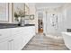 Luxurious bathroom with double vanities, a glass-enclosed shower, and a walk-in closet at 141 Castle Dr, Mooresville, NC 28117